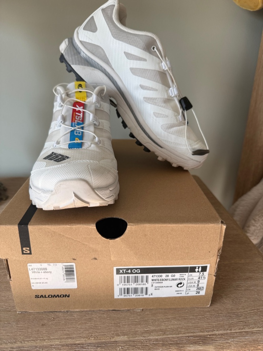 Salomon White Trail Running Shoes with Black and Yellow Accents